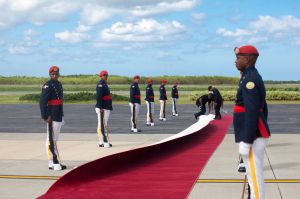 The wind blows the red carpet moments before President Jocelerme Privert, of Haiti, arrives at the Punta Cana ...