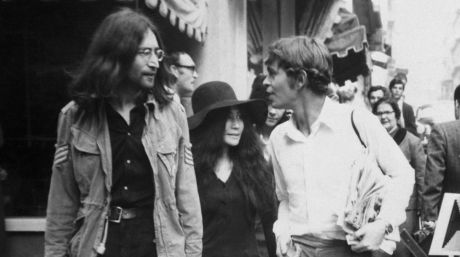 John Lennon  with wife Yoko Ono and Greek host, Alexis Mardas,  during a tour of Athens' shops. 