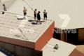 Youths on the roof of Malmsbury Youth Justice centre.