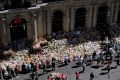 Floral tributes grow at the Bourke Street Mall. 