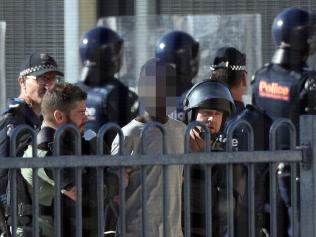 ***THESE ARE YOUTH OFFENDERS - LEGAL THESE PICS BEFORE PUBLICATION*** 25/1/17 Police officers respond to a riot at the Malmsbury youth detention centre. Riot squad officers begin to remove offenders one by one. Aaron Francis/The Australian