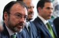 Mexico's Foreign Relations Secretary Luis Videgaray, second left, speaks to the press.