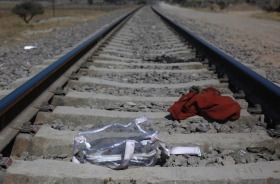 Clothing and a backpack lay on the tracks of the railroad used by migrants jumping trains traveling northbound, on the ...