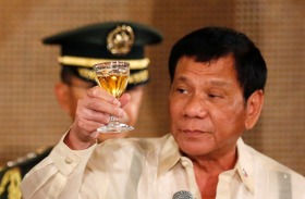 Japanese Prime Minister Shinzo Abe and Philippine President Rodrigo Duterte toast during a state banquet. The ...