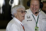 Formula One boss Bernie Ecclestone stops at the McLaren team box during the first free practice at the Yas Marina racetrack in Abu Dhabi, United Arab Emirates, Friday, Nov. 25, 2016.