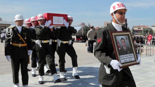 Turkish soldiers carry the coffin of Lieutenant Murat Taylan Oncel, 33, killed in an October mortar attack by Kurdish ...