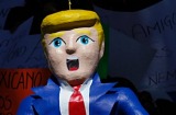 Pinatas in the likeness of U.S. President Donald Trump hang on a length of wire during a protest in Mexico City, Friday, ...