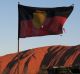 Uluru with Aboriginal flag flying