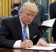 US President Donald Trump signs an executive order reinstating the gag rule prohibiting receivers of aid from discussing ...