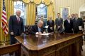 US President Donald Trump signs an executive order reinstating the gag rule prohibiting receivers of aid from discussing ...