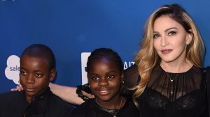 Madonna with son David Banda and daughter Mercy James and Sean Penn at Haiti gala last year. 
