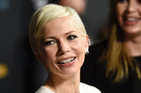 Michelle Williams, a cast member in "Manchester by the Sea," looks down the carpet at the premiere of the film at the ...