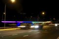 Coloured lights illuminate the Malcolm Fraser Bridge over the Molonglo River at Pialligo.