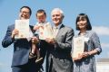 Originally from China, two-year-old Eric Guo was fascinated by his citizenship certificate as he and his parents Rui Guo ...