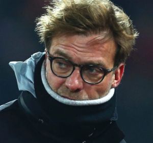 Liverpool's head coach Juergen Klopp leaves the pitch before kick off in the English League Cup semifinal 2nd leg soccer ...