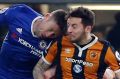 Hull City's Ryan Mason, right, was injured during this clash of heads with Chelsea's Gary Cahill.