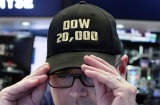 Specialist Mario Picone adjusts his Dow 20,000 cap as he works on the floor of the New York Stock Exchange on Wednesday. 