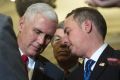 Vice President-elect Mike Pence speaks with Reince Priebus, chief of staff for President-elect Donald Trump, right, as ...
