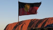 Uluru with Aboriginal flag flying