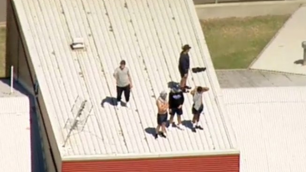 Youths on the roof of the Malmsbury Justice Centre.