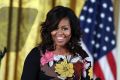 After a long break, Michelle Obama plans to get to work with a small staff that will move into office space in Washington. 