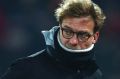 Liverpool's head coach Juergen Klopp leaves the pitch before kick off in the English League Cup semifinal 2nd leg soccer ...
