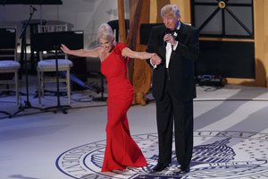 President-elect Donald Trump, right, holds the hand of Kellyanne Conway, his campaign manager, as she takes a bow during a VIP reception and dinner with donors, Thursday, Jan. 19, 2017, in Washington.