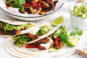 Beef and chorizo fajitas with mashed avocado