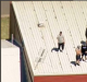 Youths on the roof of the Malmsbury Justice Centre.