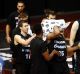 Breakers players applaud Akil Mitchell as he is helped off the court after suffering a serious eye injury on Thursday night.