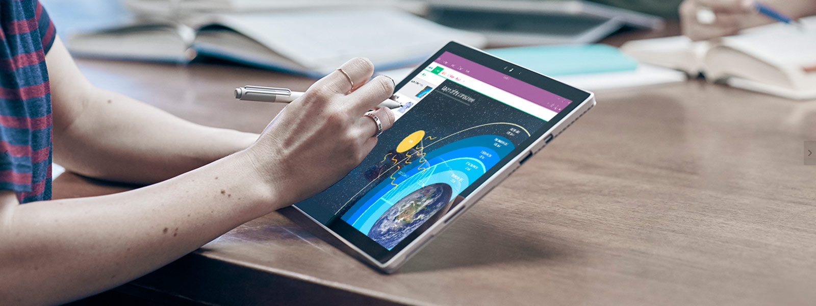 Woman using Surface Pen to draw on Surface Pro 4 in tablet mode