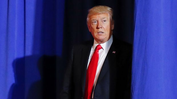 President Donald Trump waits to be introduced at the Homeland Security Department on Wednesday.