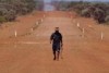 Clinton Pryor walking through Australia's outback in sweltering heat