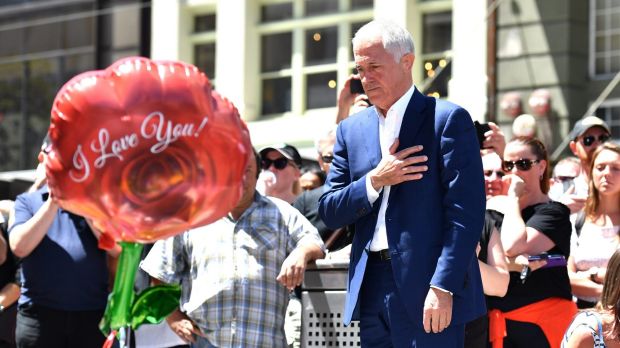 Malcolm Turnbull lays flowers at a makeshift Bourke Street memorial.