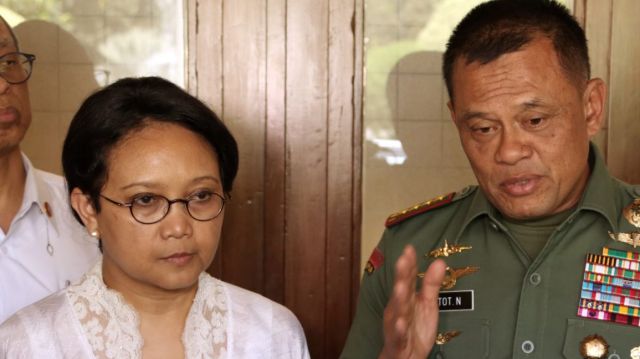 Indonesian Armed Forces Chief General Gatot Nurmantyo, right, speaks to the media as Foreign Minister Retno Marsudi, ...