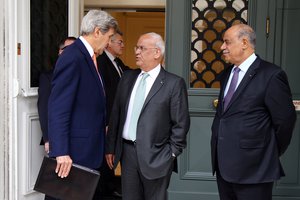 File - U.S. Secretary of State John Kerry chats with Chief Palestinian Negotiator Saeb Erekat upon concluding his meeting with State of Palestine President Mahmoud Abbas at the Le Meurice Hotel in Paris, France on July 30, 2016.