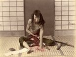 A Samurai warrior appears to commit Seppuku or Harakiri in Japan - the ritual of taking one's life through disembowelment 