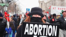 A woman walks in the 32nd Annual March For Life in Washington, 2005.