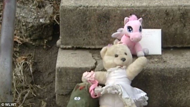 A makeshift memorial (pictured) was placed on the steps of her family's home. The community gathered together after the shooting and several faith leaders are hoping to raise at least $9,000 toward a reward for information leading to an arrest