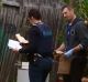 Police look through a yard where four escapees from the Malmsbury youth detention centre were captured. 