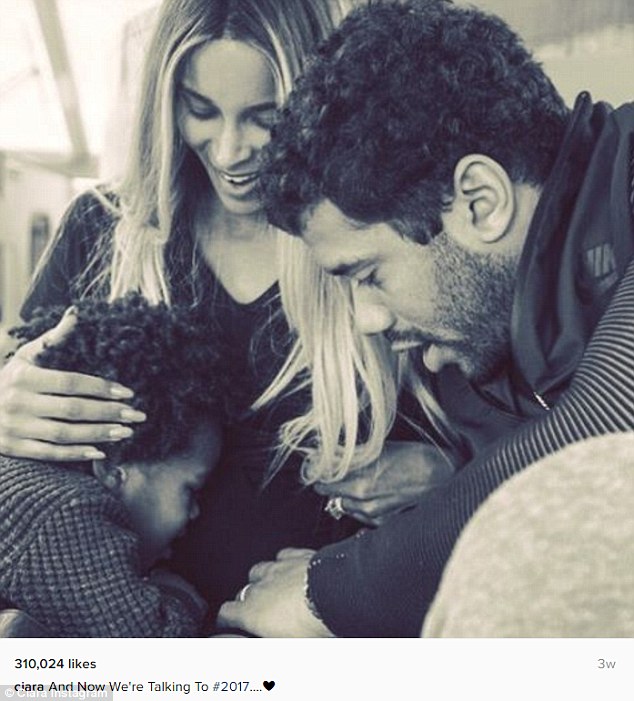 Growing family: Ciara and her Seattle Seahawks player husband, Russell Wilson, took a family photo in January with her two-year-old son, Future, kissing her pregnant belly