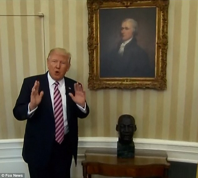 President Trump posed next to the bust to prove that it had not been removed. It remains in the Oval Office beneath a portrait of statesman Alexander Hamilton who founded the New York Post, Trump's favorite newspaper 