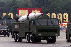 File - A military truck carries China's Dongfeng missile during the 50th anniversary parade in the Tiananmen Square, Beijing, Friday, Oct. 1, 1999. China showcased its most up-to-date military hardware.