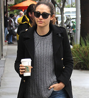 Low key: Emmy Rossum sported a casual grey knit sweater, black pea coat and blue jeans as she stepped out for coffee on a cold and rainy day in Los Angeles