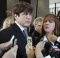 FILE - In this Dec. 7, 2011 file photo, former Illinois Gov. Rod Blagojevich, left, speaks to reporters as his wife, Patti, listens at the federal building in Chicago. A daughter of Blagojevich is criticizing former President Barack Obama for not granting early release to her father, who's serving prison time for corruption. In an emotional letter, 20-year-old Amy Blagojevich called Obama "spineless" for not commuting her father's sentence. Blagojevich's wife, Patti, posted the letter on her Facebook page. (AP Photo/M. Spencer Green, File)