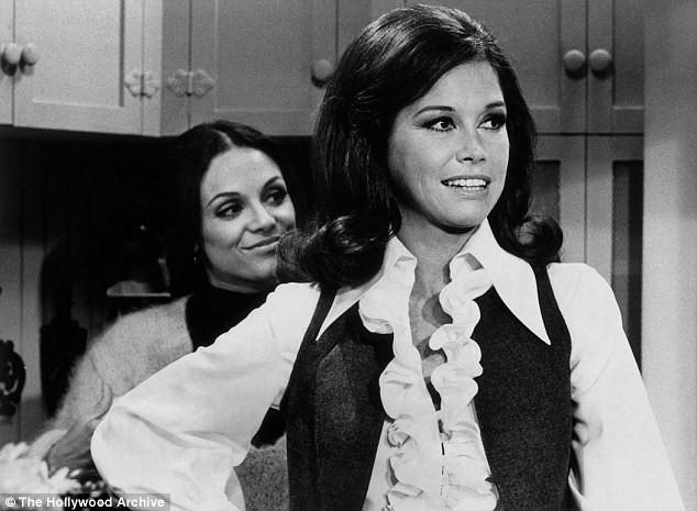 Best friends: Moore is shown as Mary Richards in a still from The MTM Show with Harper as her brash neighbor Rhoda Morgenstern