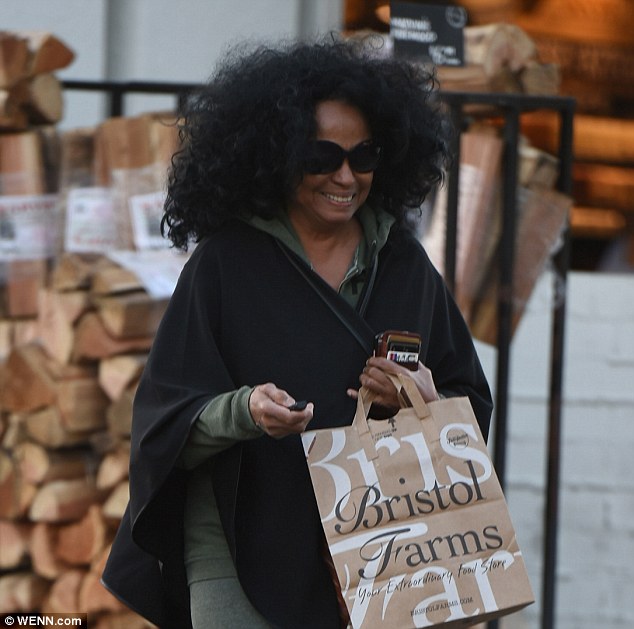 Iconic: Of course her wild, curly raven locks were on full display, and allowed to waft freely in the breeze