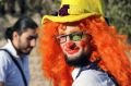 Syrian social worker Anas al-Basha, 24, dressed as a clown, while posing for a photograph in Aleppo, Syria. 