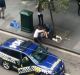 Henry Dow and taxi driver Lou caring for a victim of the Bourke Street attack.