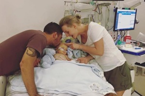 Josh Roberts and Katelyn Galea with son Archie, who has been taken off life support. 